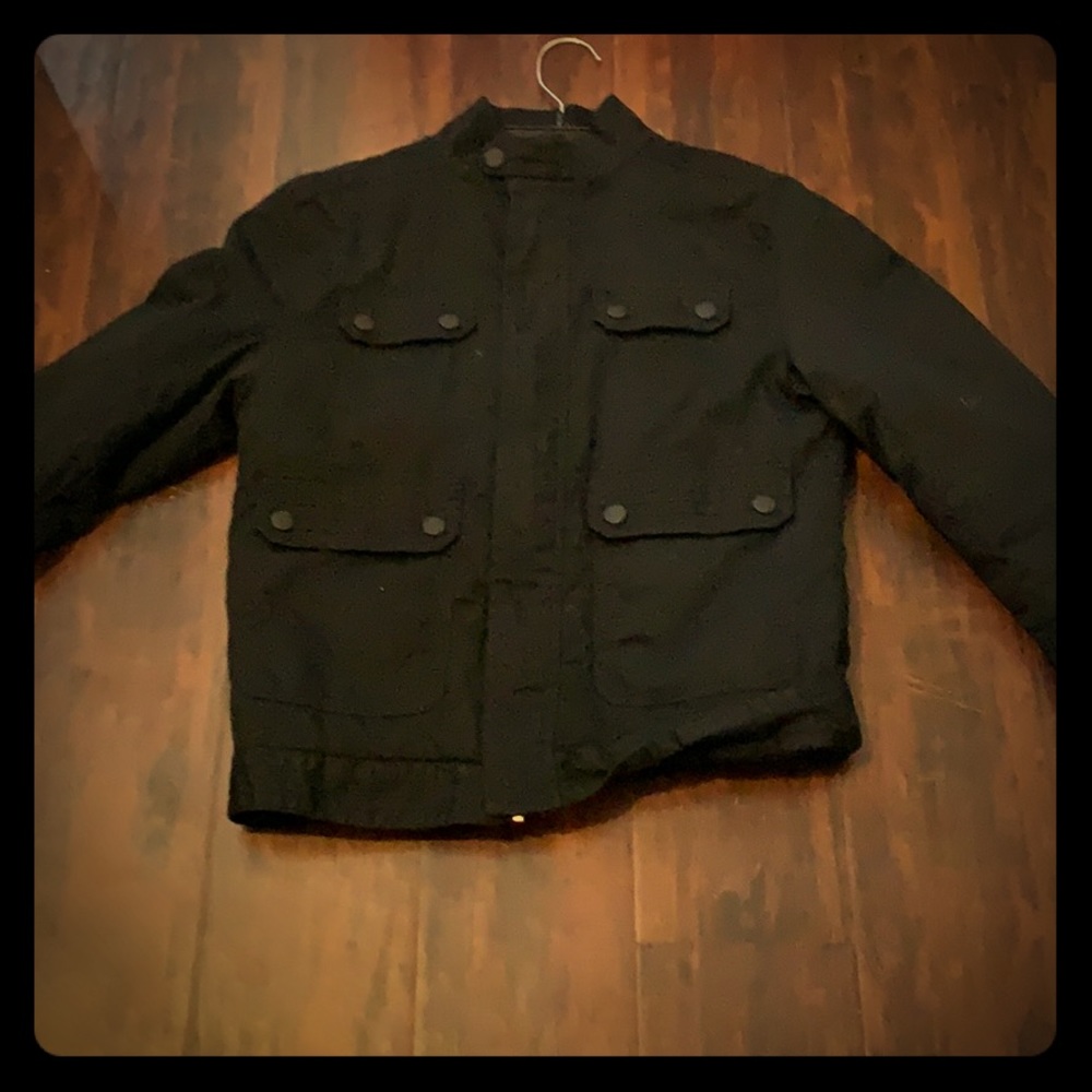 A jacket that is black and from Shawn white.